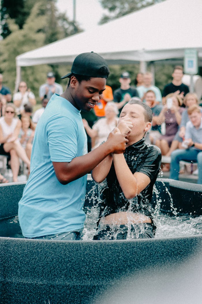 An outdoor baptism in Clemson, showing joy and community spirit.